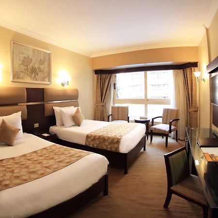 Pyramisa Suites Hotel Cairo Giza Экстерьер фото A room at the hotel