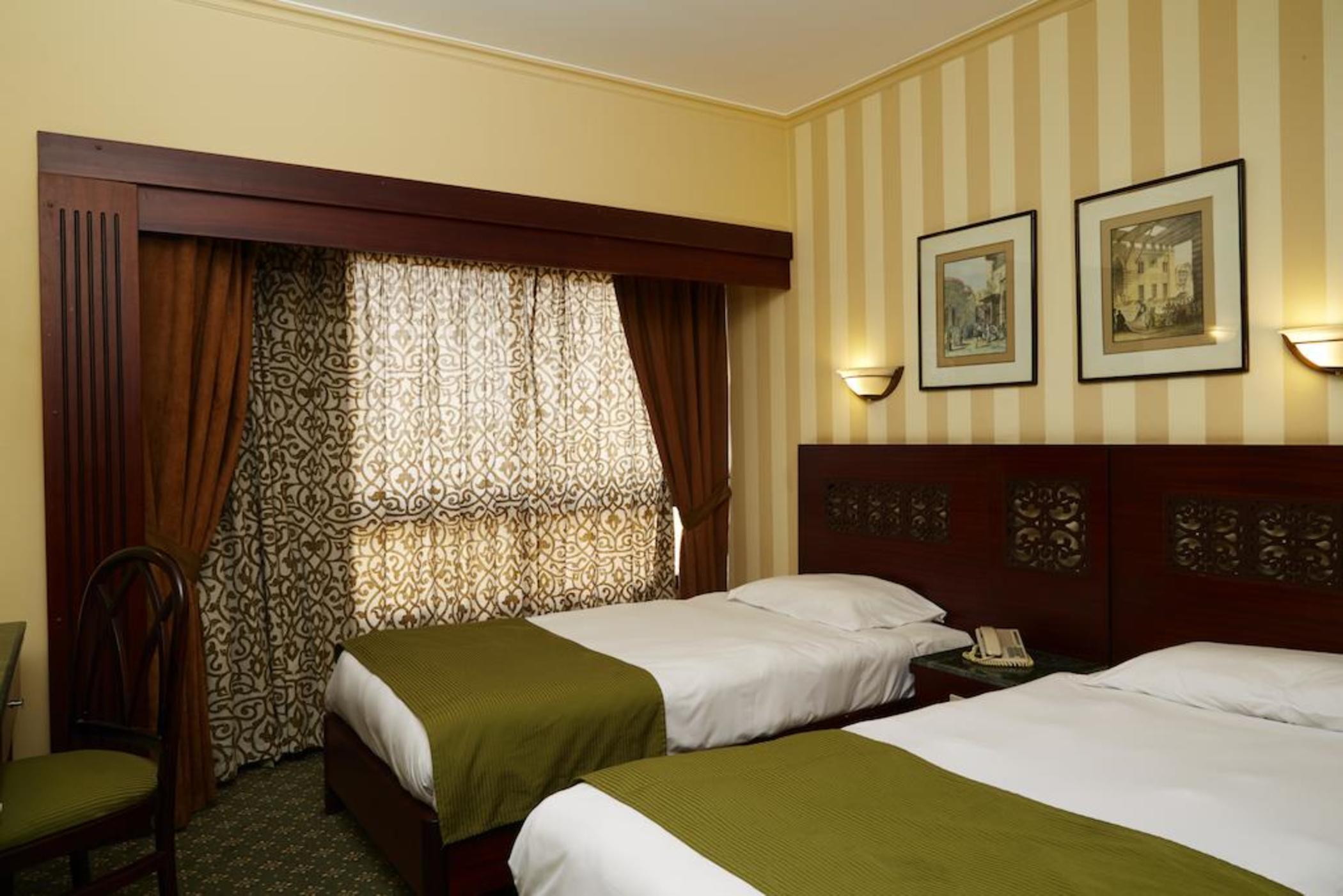 Pyramisa Suites Hotel Cairo Giza Экстерьер фото A room at the hotel